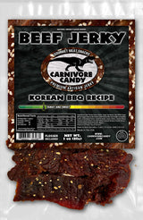 Carnivore Candy PNW packaging of Korean BBQ Beef Jerky with visible sesame seeds and jerky pieces.