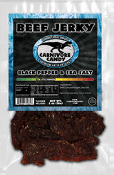 Carnivore Candy PNW packaging of Beef Jerky features flavors listed as Black Pepper & Sea Salt. The product is displayed in a clear window showing the jerky inside.