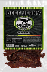 Carnivore Candy PNW packaging of Teriyaki Beef Jerky features the product visible through the transparent window. The package has a green and black color scheme with text and branding.